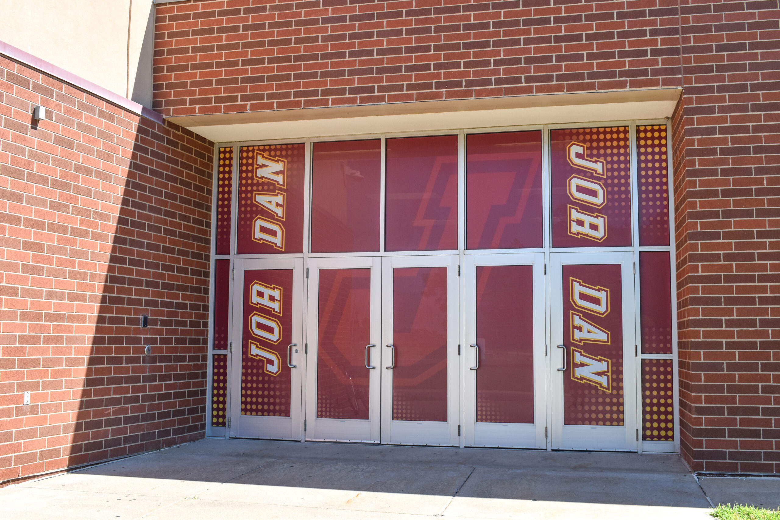 Jordan High School activities entrance doors with Jordan branding