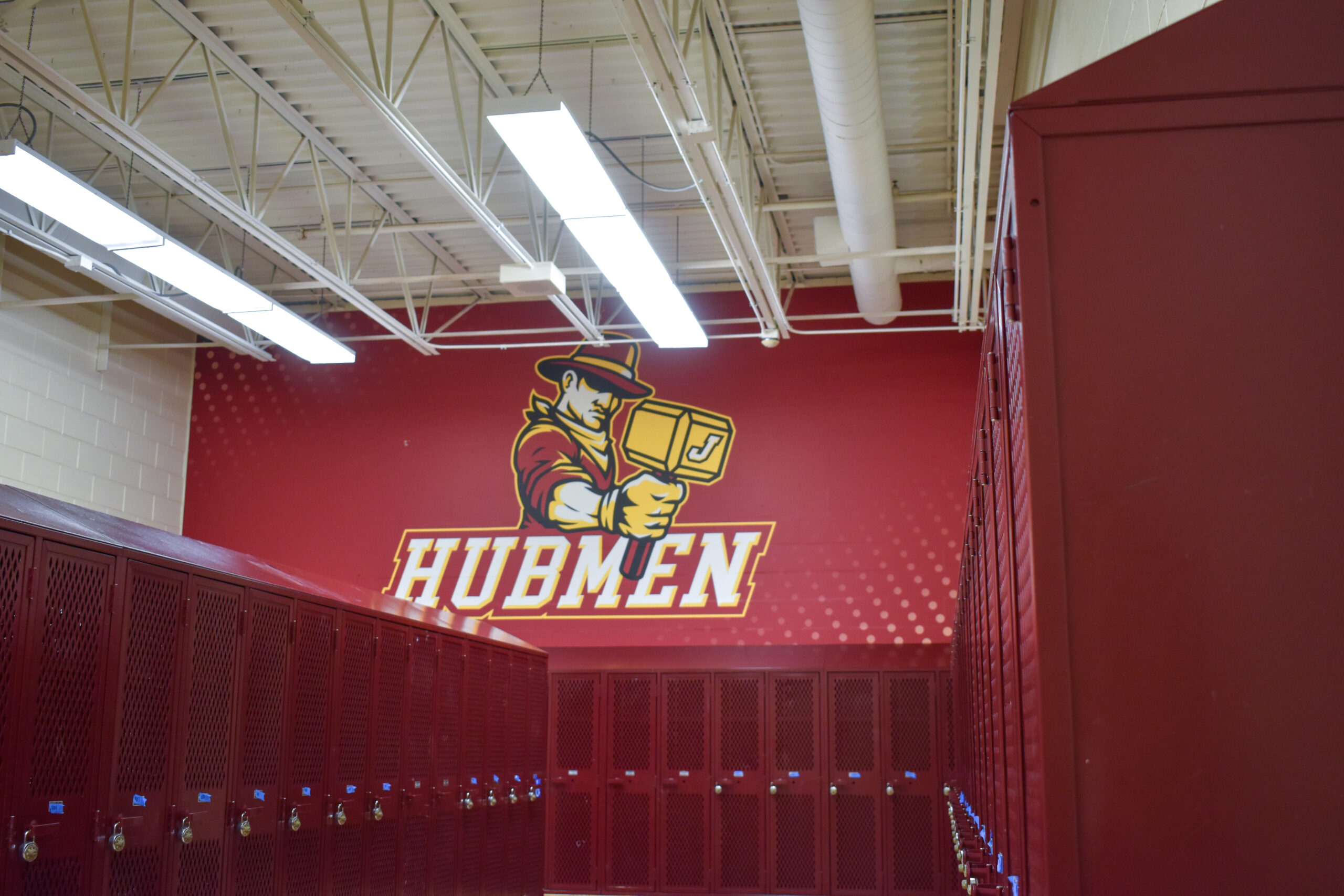 Jordan Hubmen mascot graphic painted on locker room wall